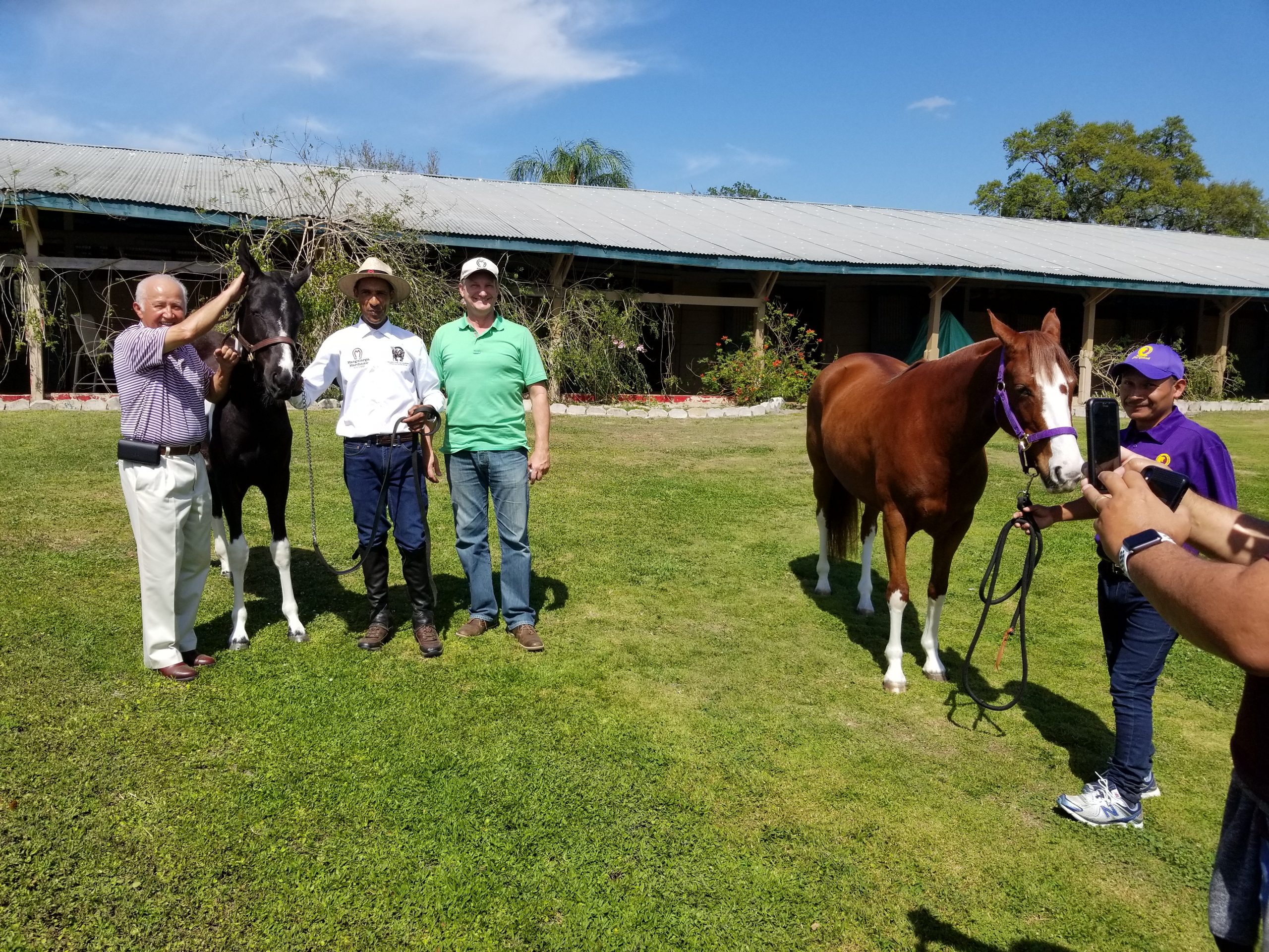 Jockey, Jacinto Vásquez and Brazilian Equestrians admiring The Brazilian National Horse: Marchador.